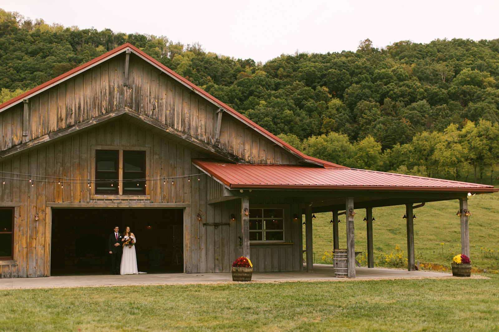 Dark timber interior of the restored barn at Claxton Farm, Weaverville North Carolina