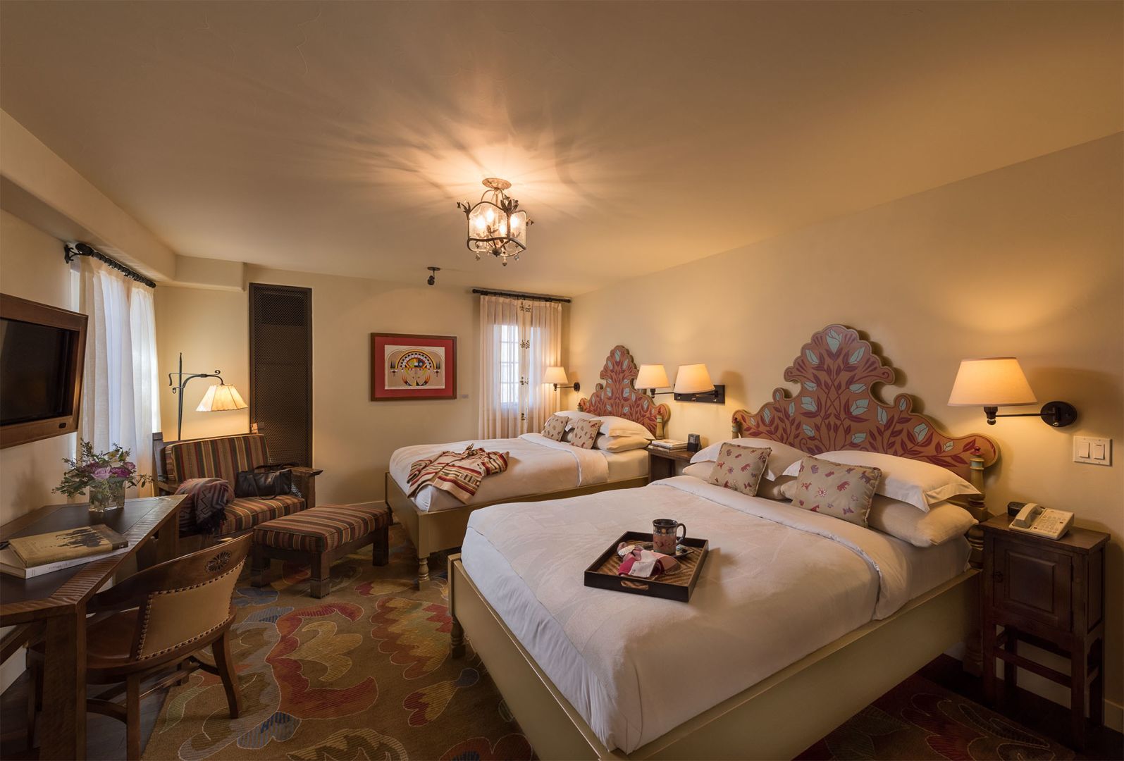 Thick adobe wall with a deep window reveal shaping daylight at La Fonda, Santa Fe