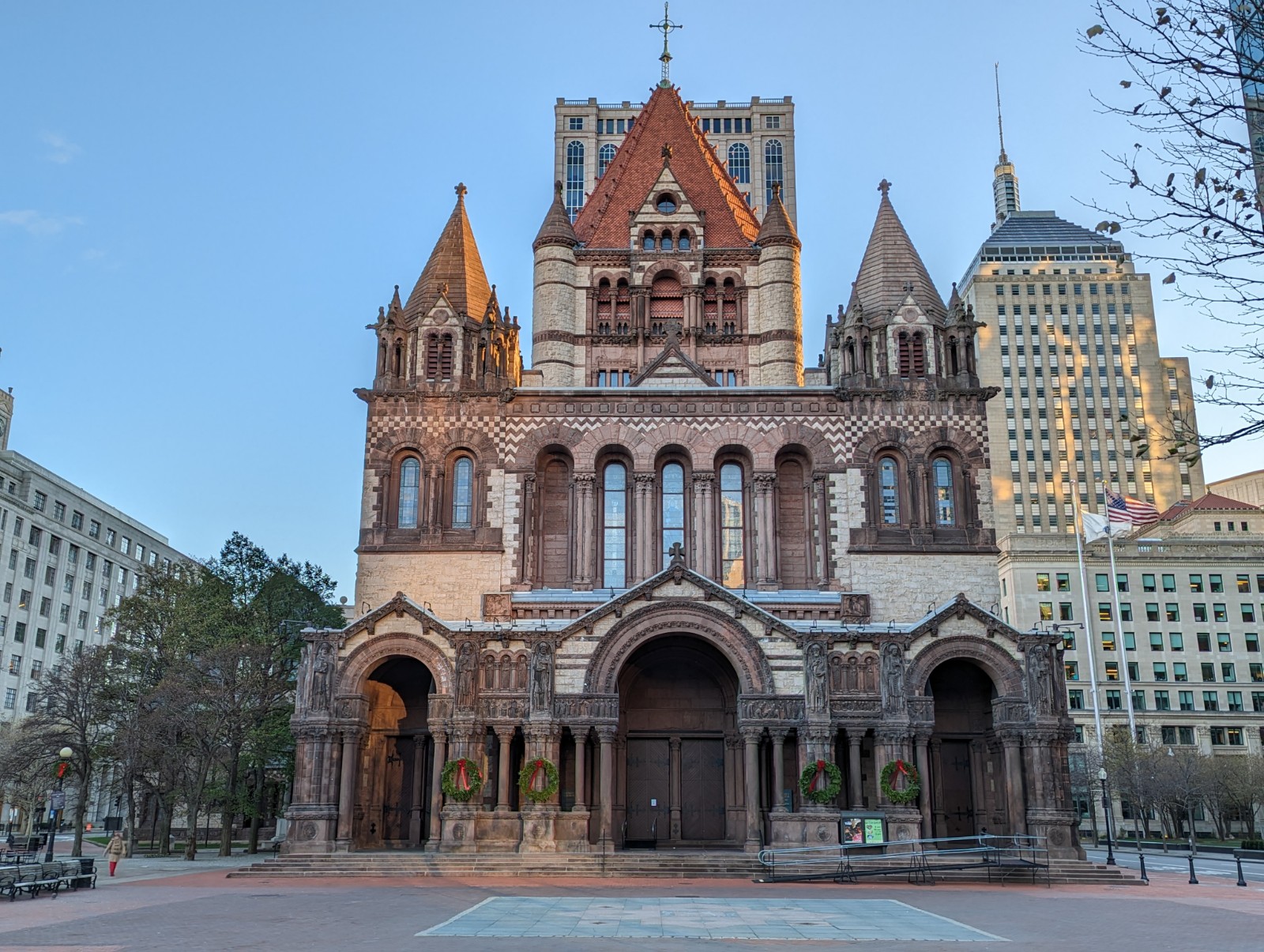 Dark stone nave interior of Trinity Church Boston with warm tungsten fixtures