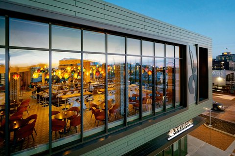 Large saturated contemporary artwork dominating a hotel interior