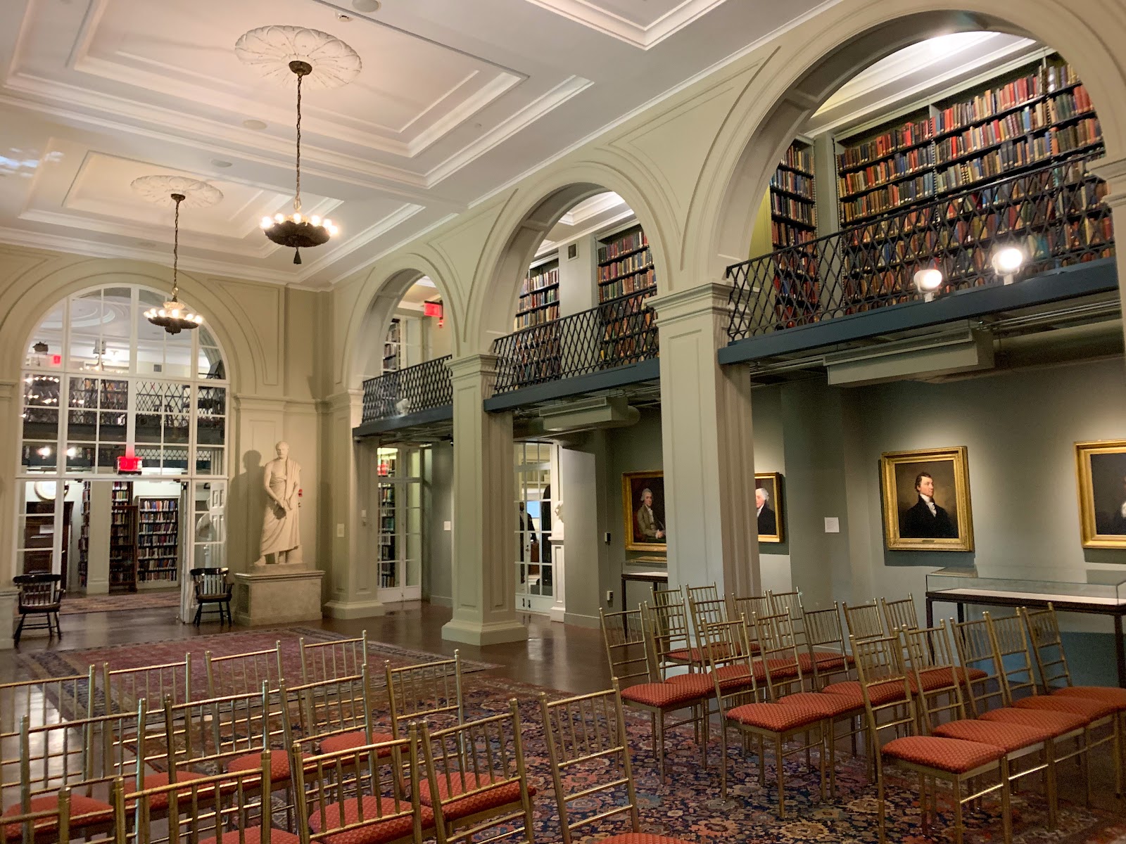 Tall reading room window at the Boston Athenaeum providing soft key light for wedding portraits