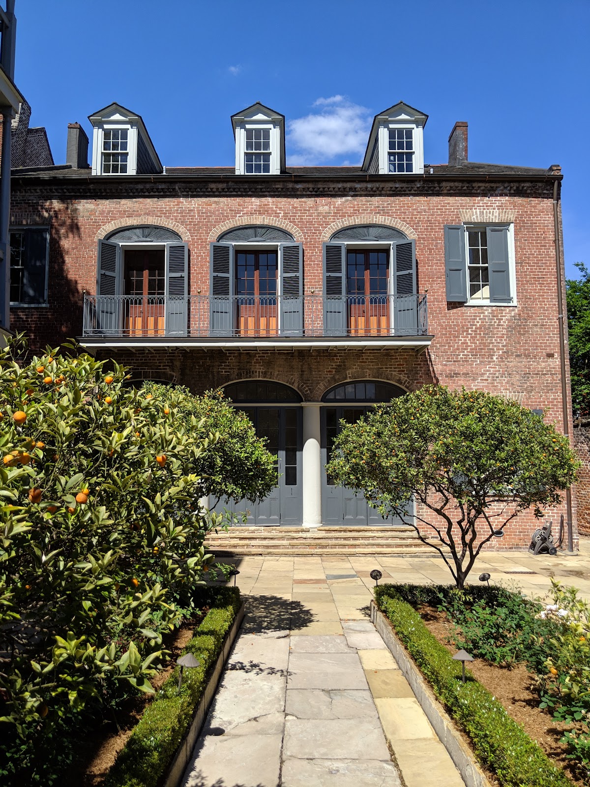 Deep window reveal in a thick 1831 wall shaping interior light at the Hermann-Grima House