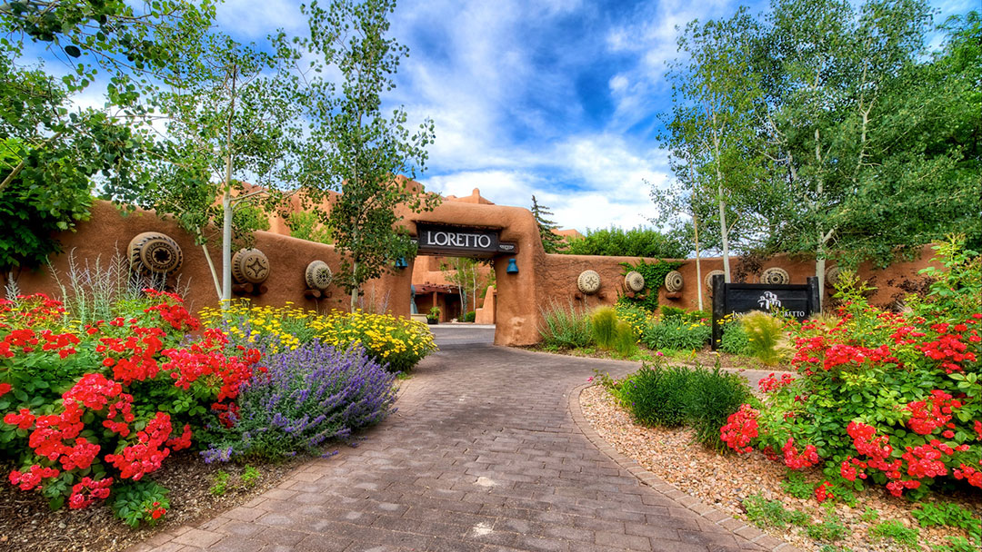 Enclosed adobe courtyard in shade with warm bounce light at the Inn and Spa at Loretto