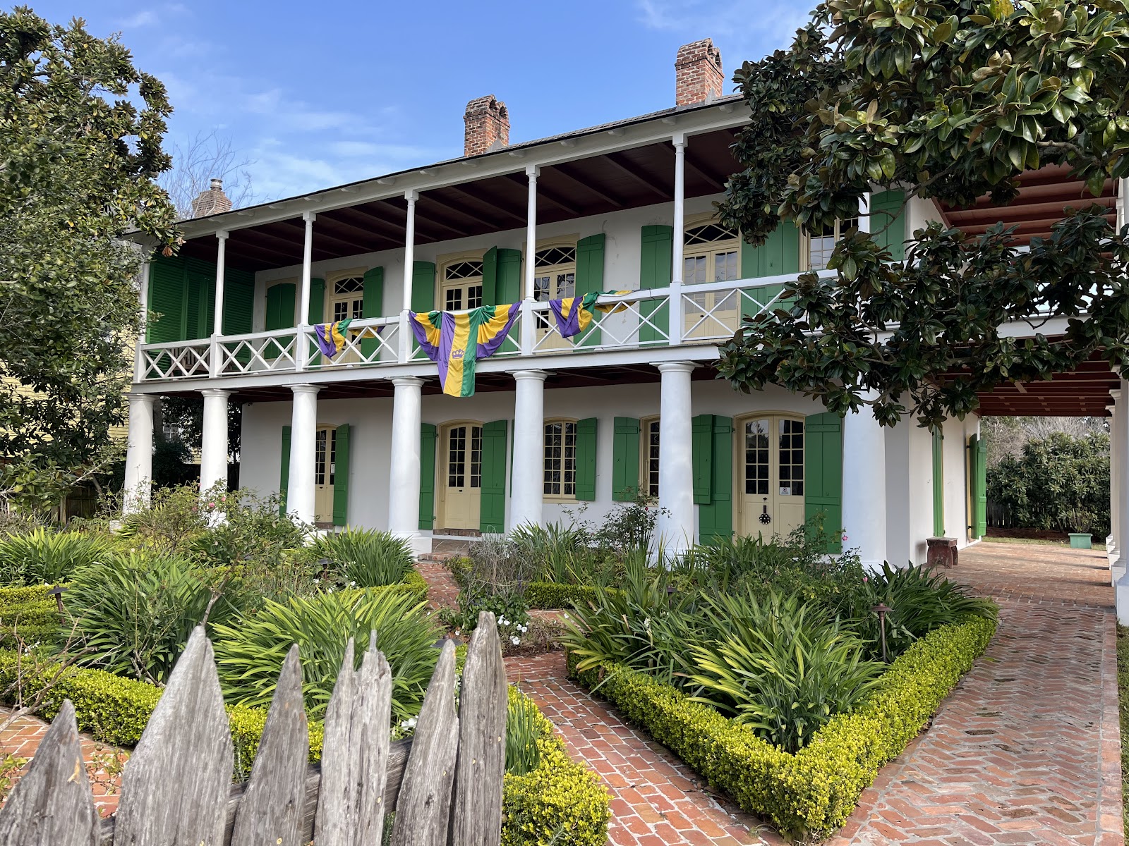 Gallery posts and balustrade receding along the Pitot House gallery, New Orleans