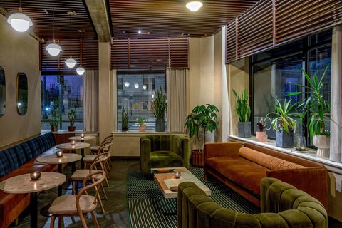 Moderate neutral-ceilinged event room at the Press Hotel set for a wedding reception
