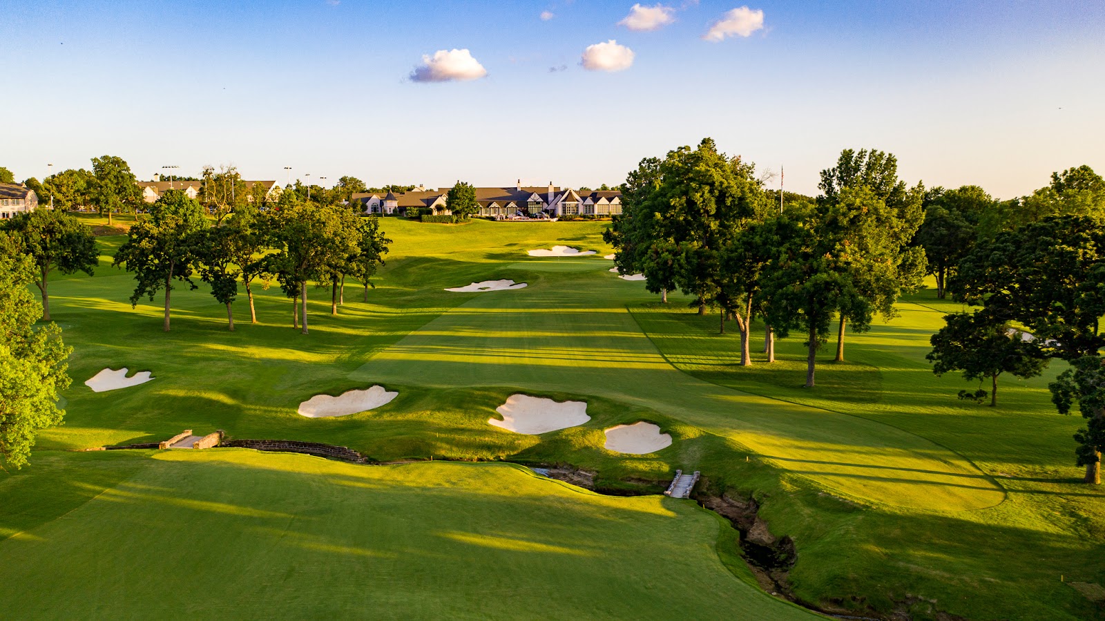 Rolling fairway contour giving a clean sky background for a wedding portrait at Southern Hills