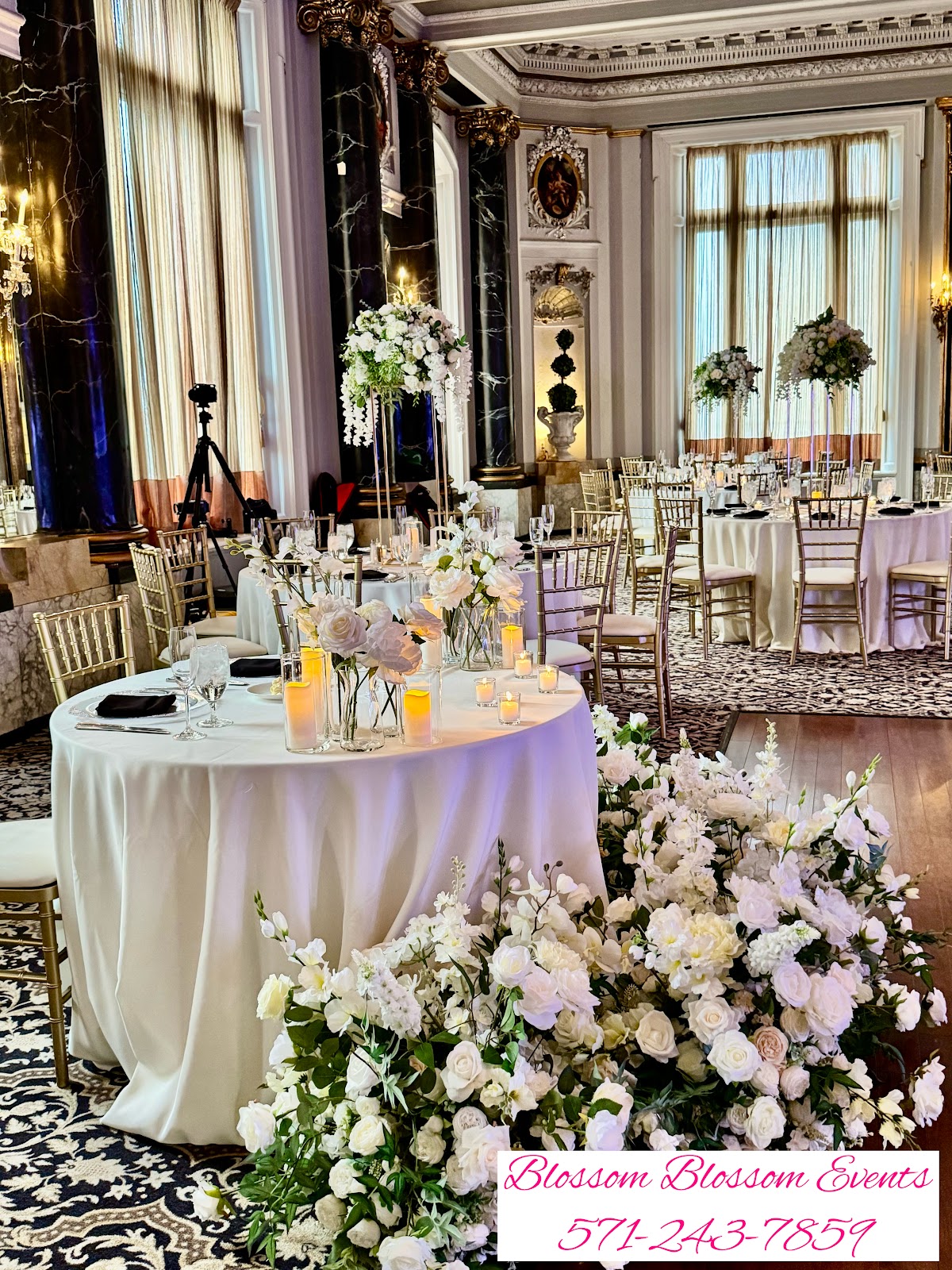 Heavily mirrored ballroom at The Belvedere Baltimore reflecting chandeliers