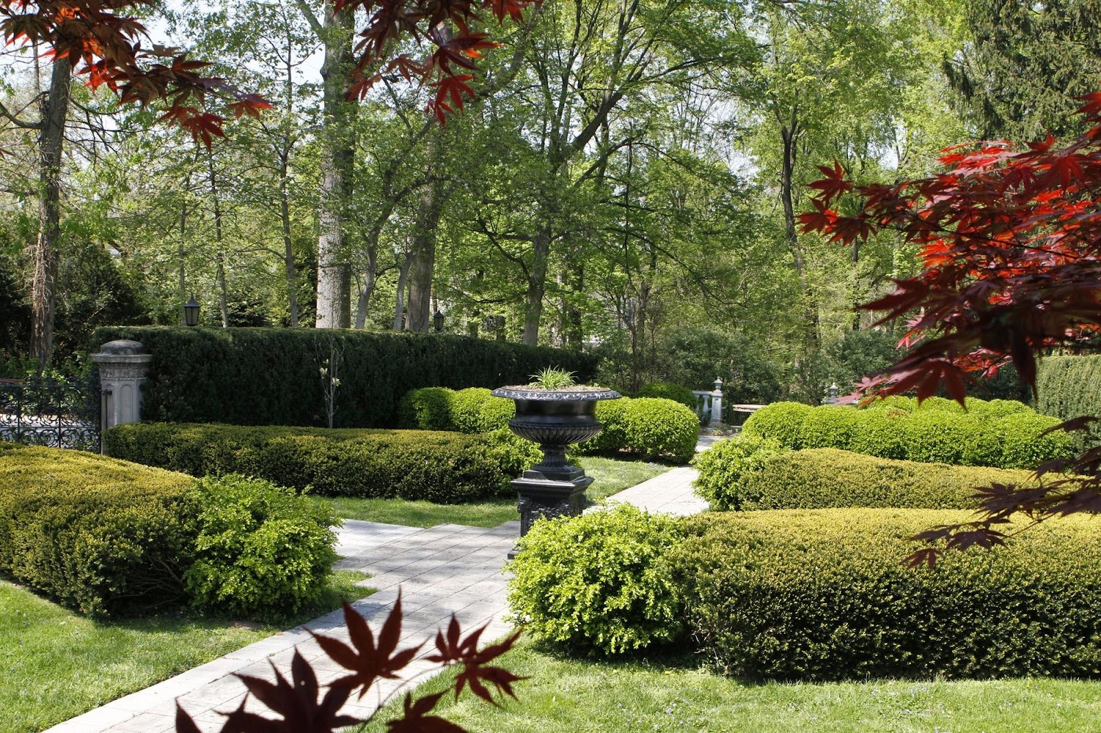 Formal garden beds and flowering planting in spring at Whitehall Mansion, Louisville