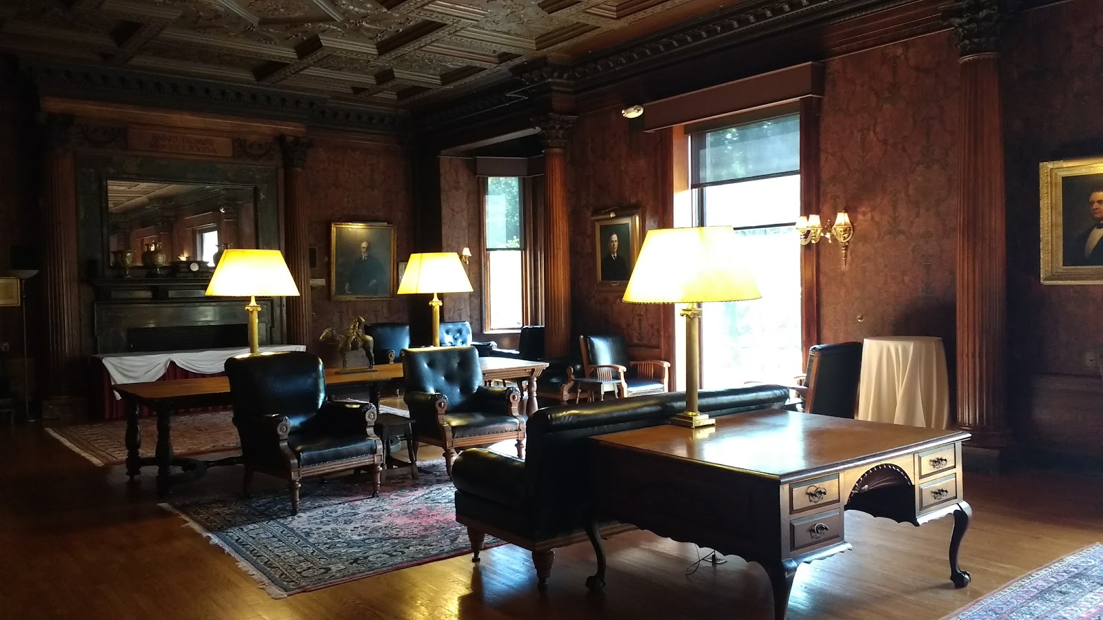 High-ceilinged reception room with tall windows at the Algonquin Club, Boston
