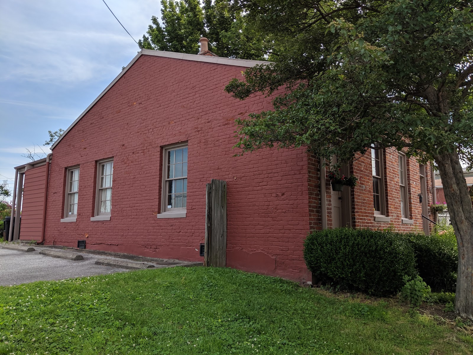 Nineteenth-century cottages and industrial buildings on a Butchertown street in Louisville