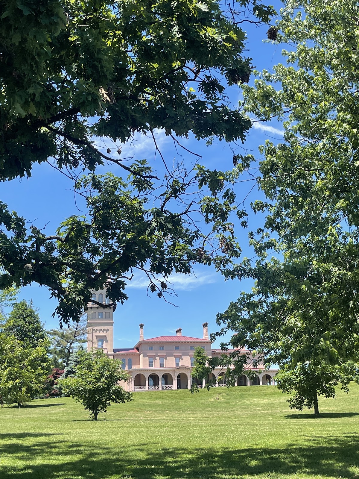Clifton Mansion and its campanile tower silhouetted in low evening light, Baltimore