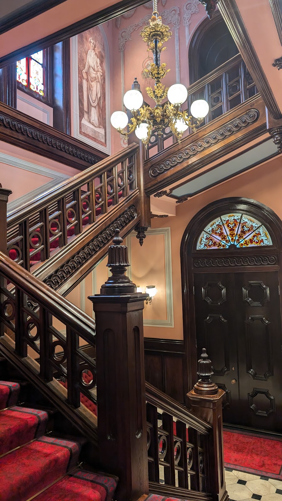 Tall narrow tower interior at Clifton Mansion with light falling from openings above