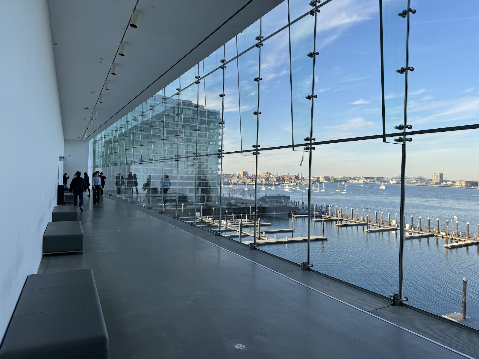 Wedding portrait beside full-height glass at the ICA Boston using the window as a side light