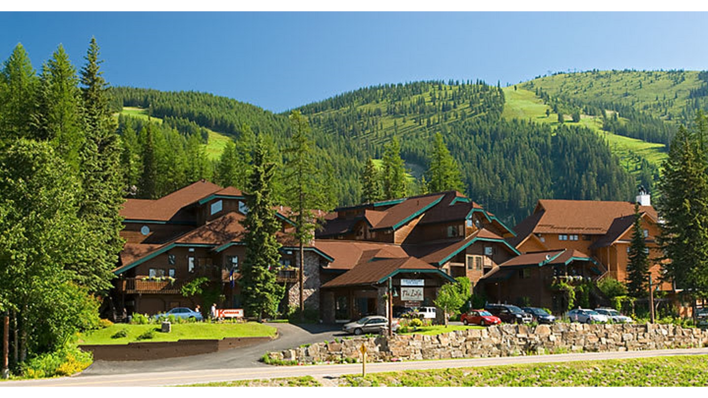 Dark stained timber interior with low ceilings at an alpine lodge in Whitefish, Montana