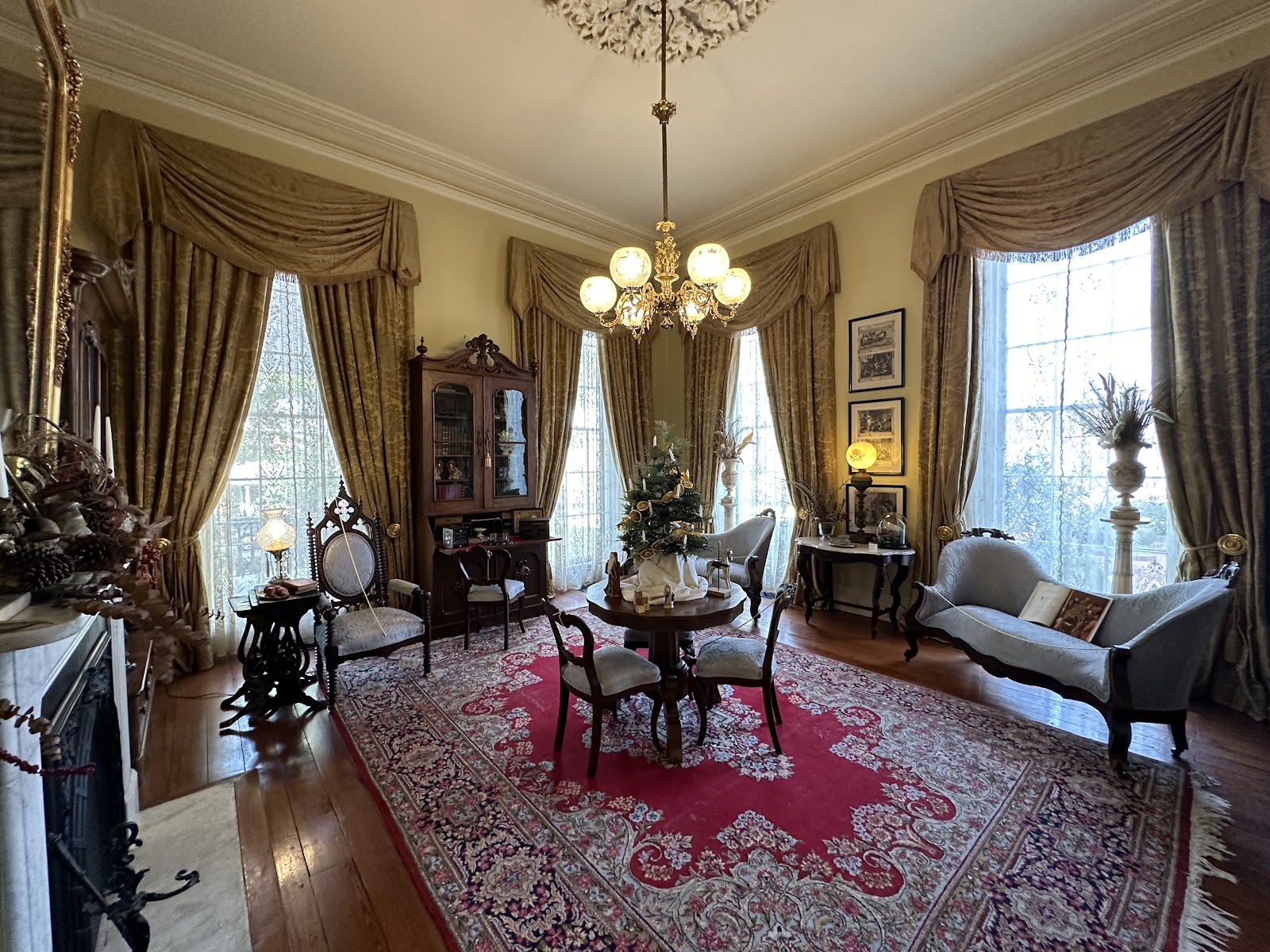 Ornate plaster ceiling medallion and crystal chandelier in a period room