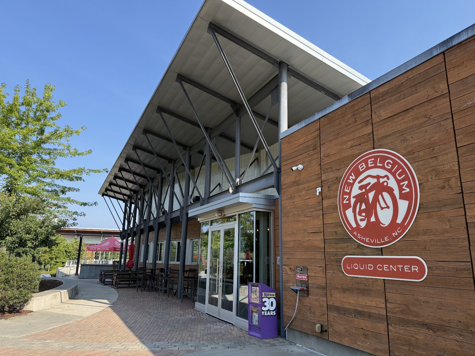 Open riverside ground at New Belgium Brewing, Asheville, used for wedding group photographs