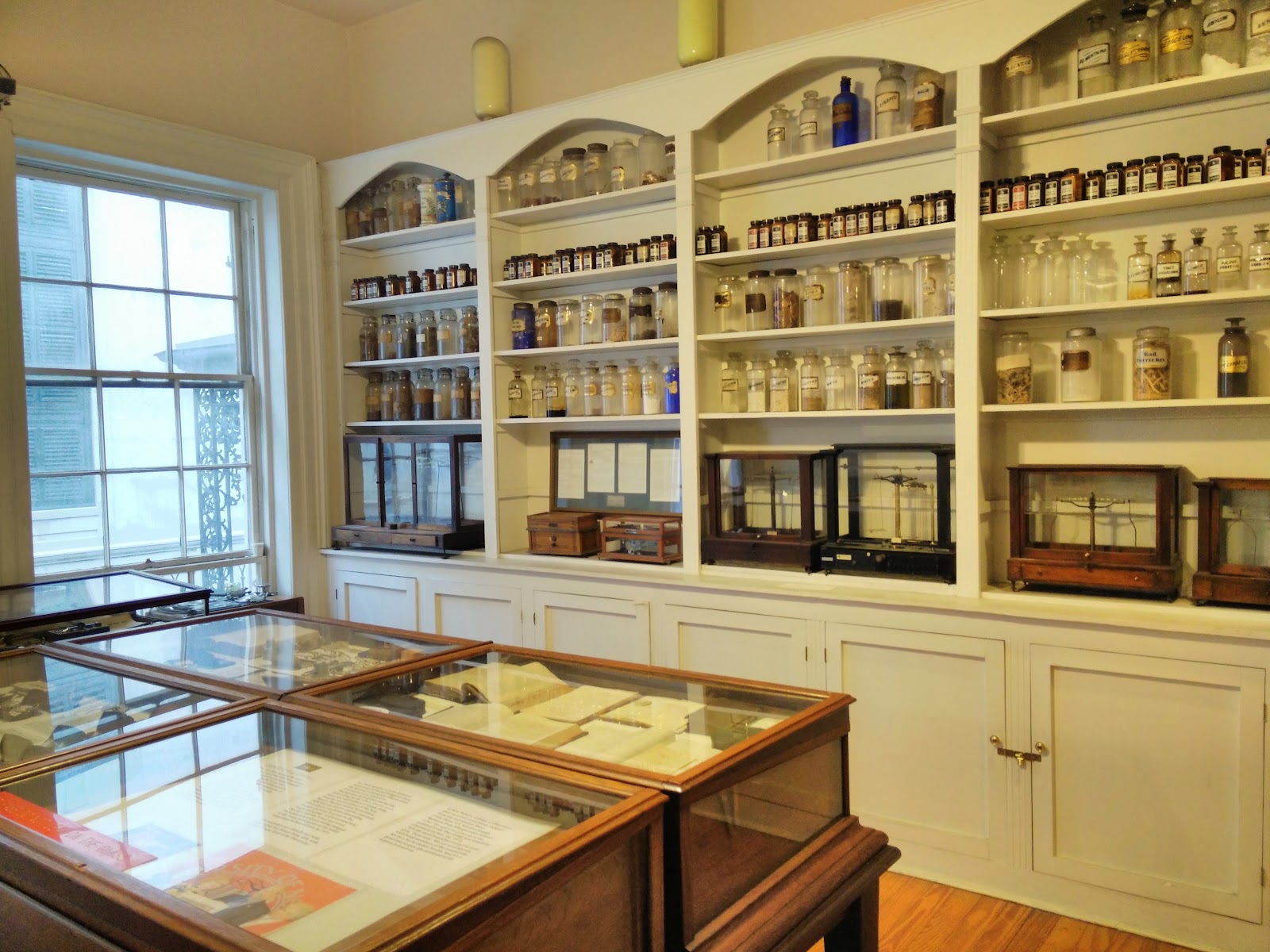 Mahogany, brass and aged apothecary labels in close detail, New Orleans Pharmacy Museum
