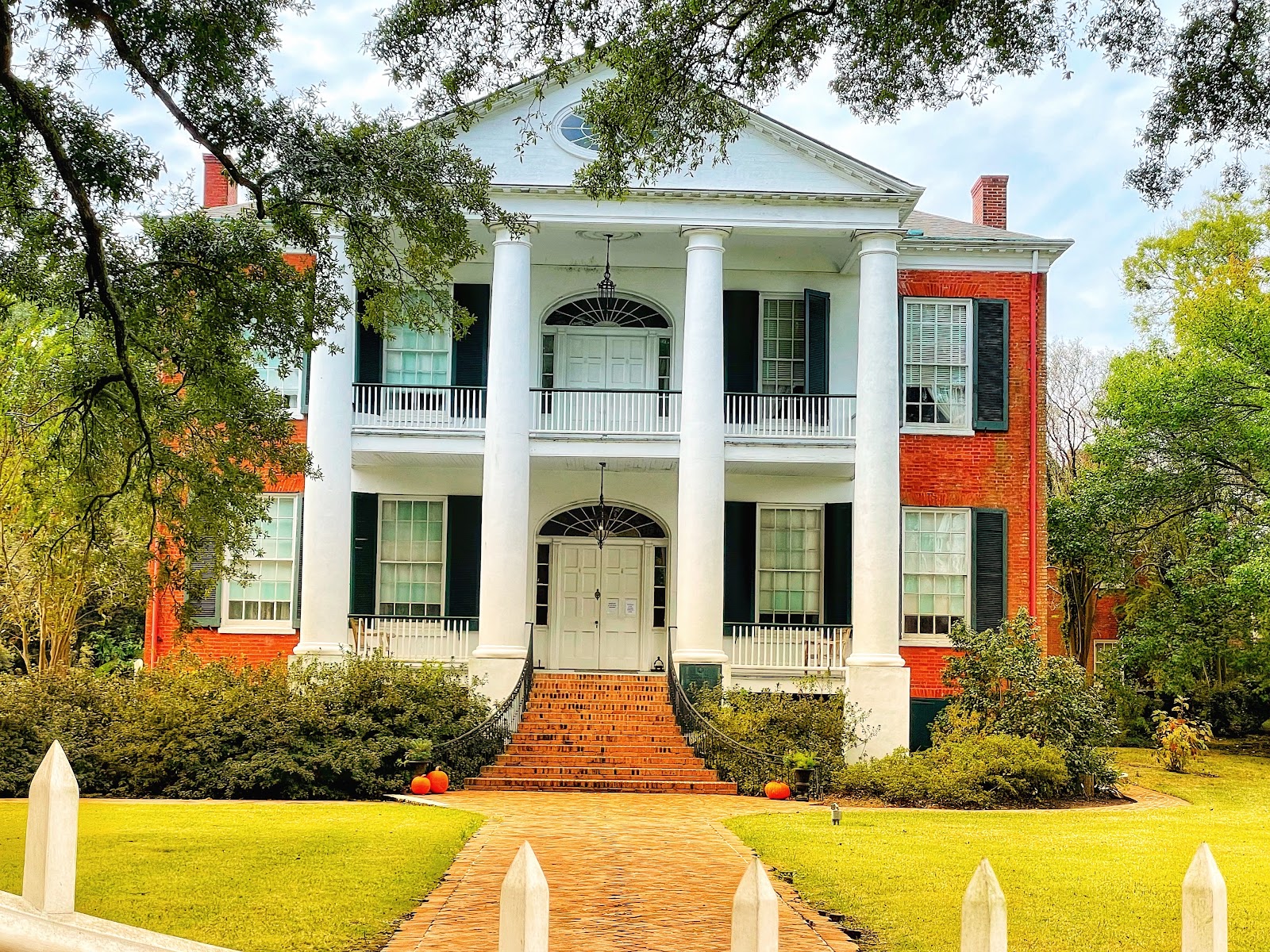 West-facing mansion elevation in soft even shade with open sky above