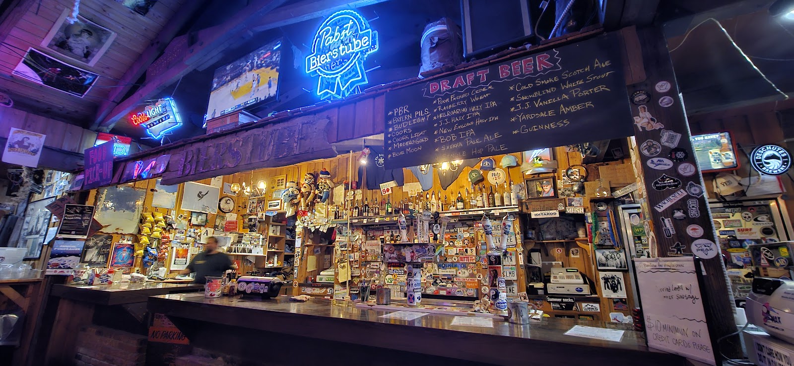 Loud crowded late-night reception in a mountain town bar, Whitefish Montana