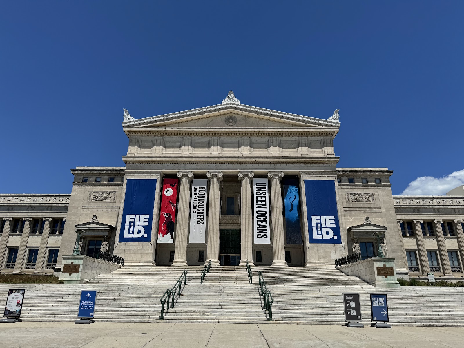 Stone colonnade at the edge of a large museum hall, Chicago
