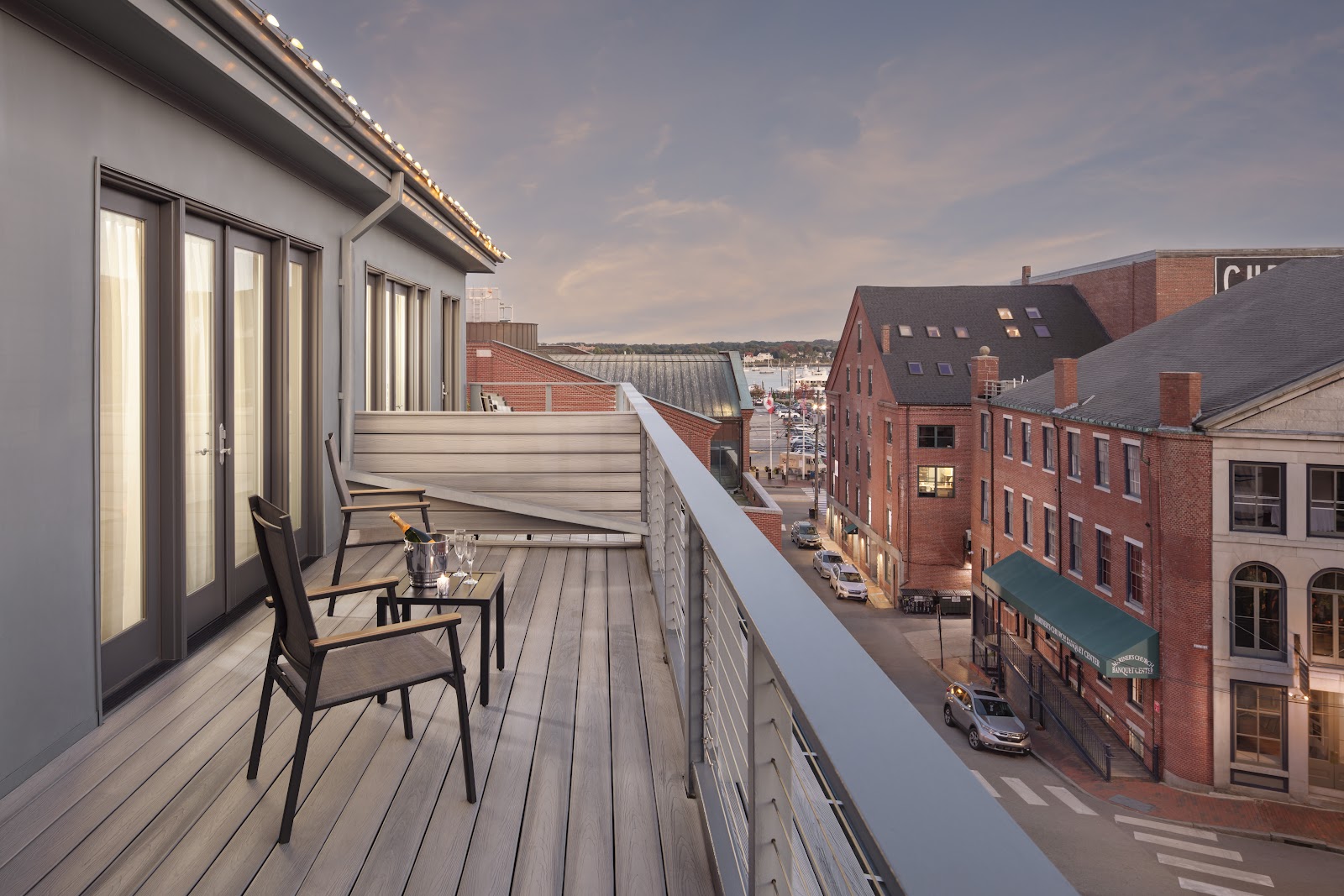 Lit restaurant frontages and wet cobbles in Portland Maine's Old Port in winter