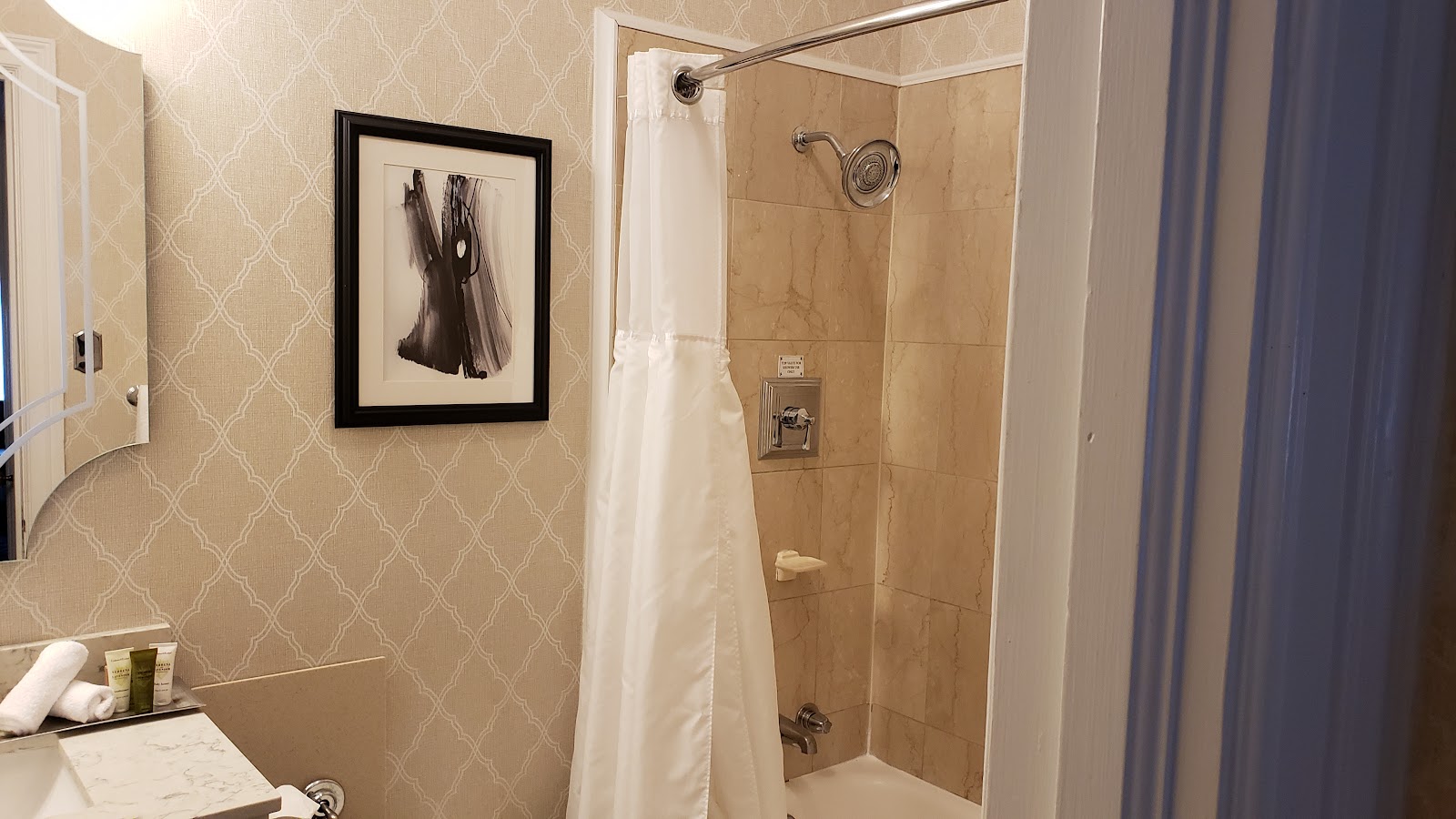 Soft window light in a patterned period hotel suite, Chicago