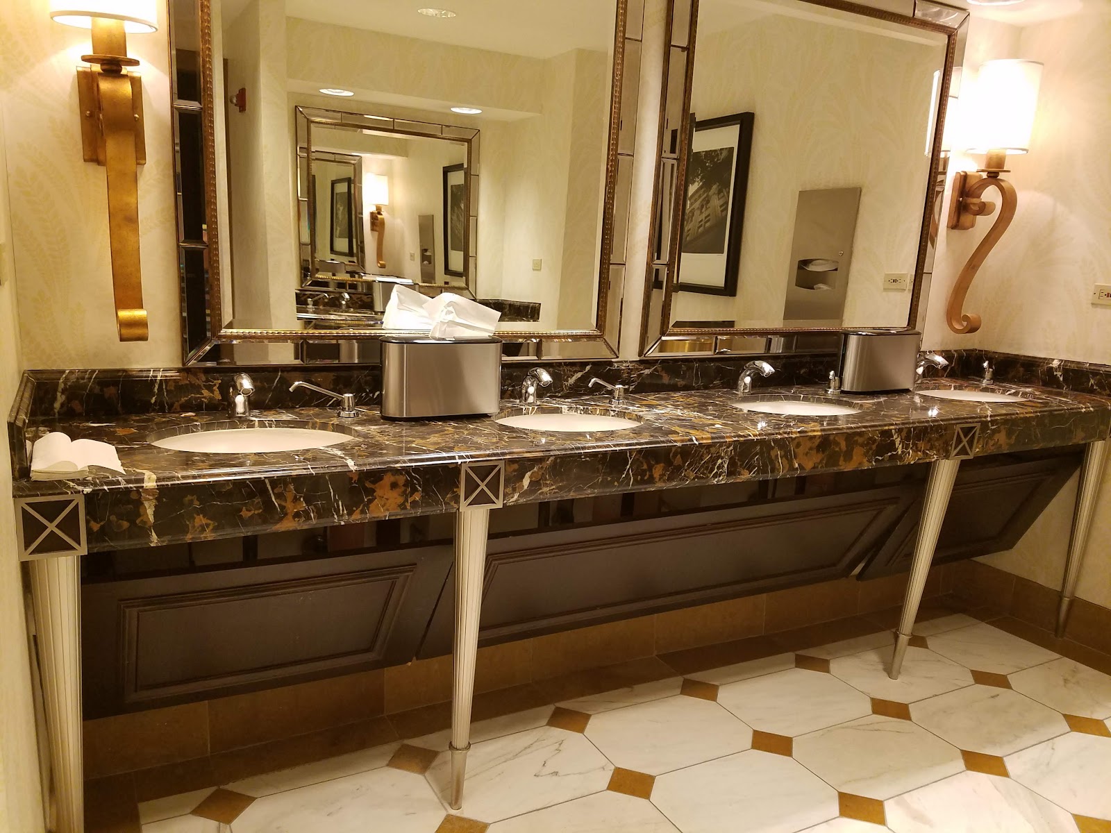 Warm tungsten lit grand hotel interior with gilded detail
