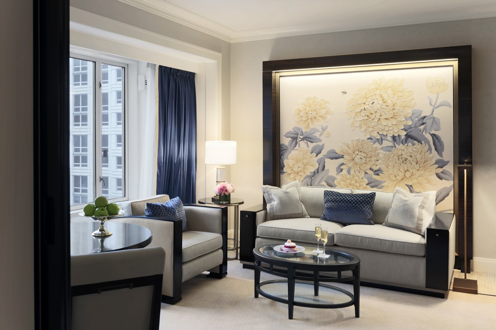 A single saturated bouquet standing out in a pale neutral hotel interior
